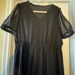 Women’s black dotted dress.
